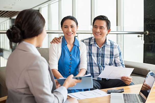 Everyone Needs an Estate Plan With Smiling Couple Meeting With Financial Planner