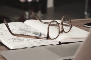 Glasses on a journal.