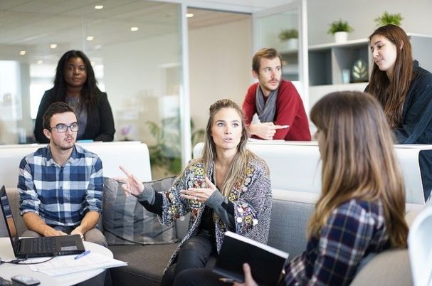 The SEP IRA image shows businessmen and women sitting together having a discussion.